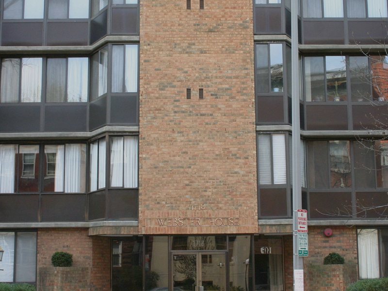 Older brick apartment building of the kind protected across Greater Boston